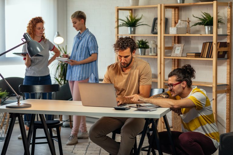 Young coworkers working together on new project in the office